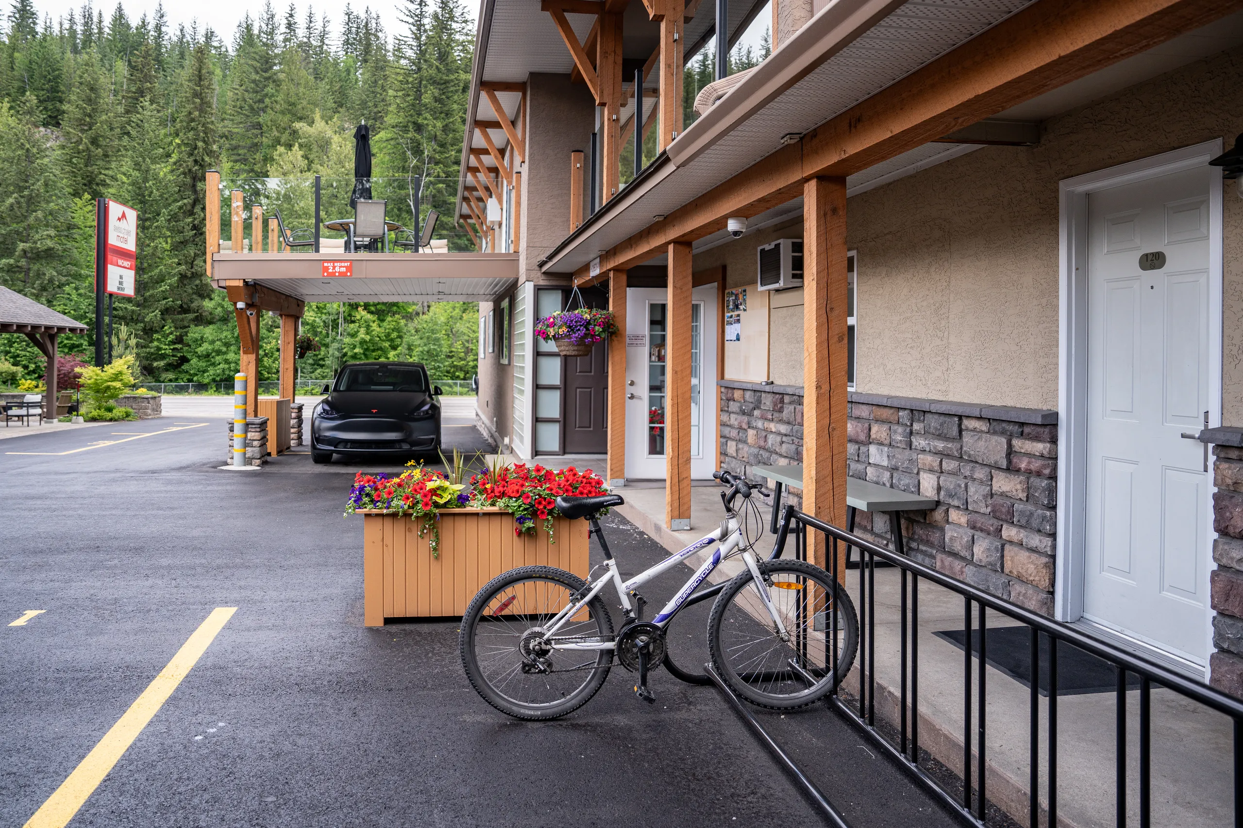 swiss chalet motel exterior ev charging 03